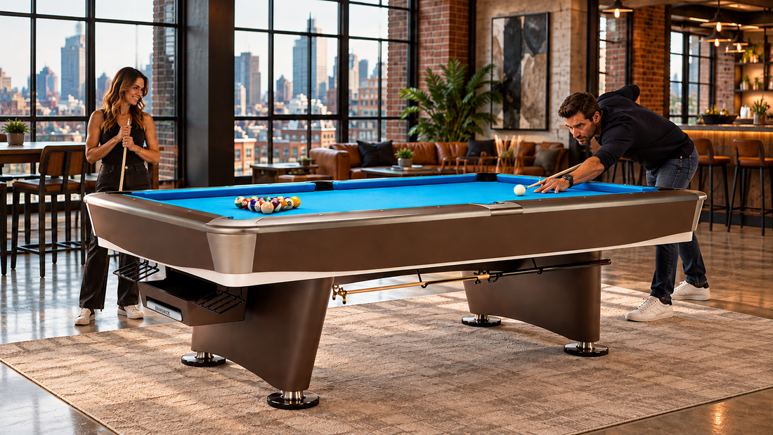 Two people playing pool in a hotel lobby near a bar
