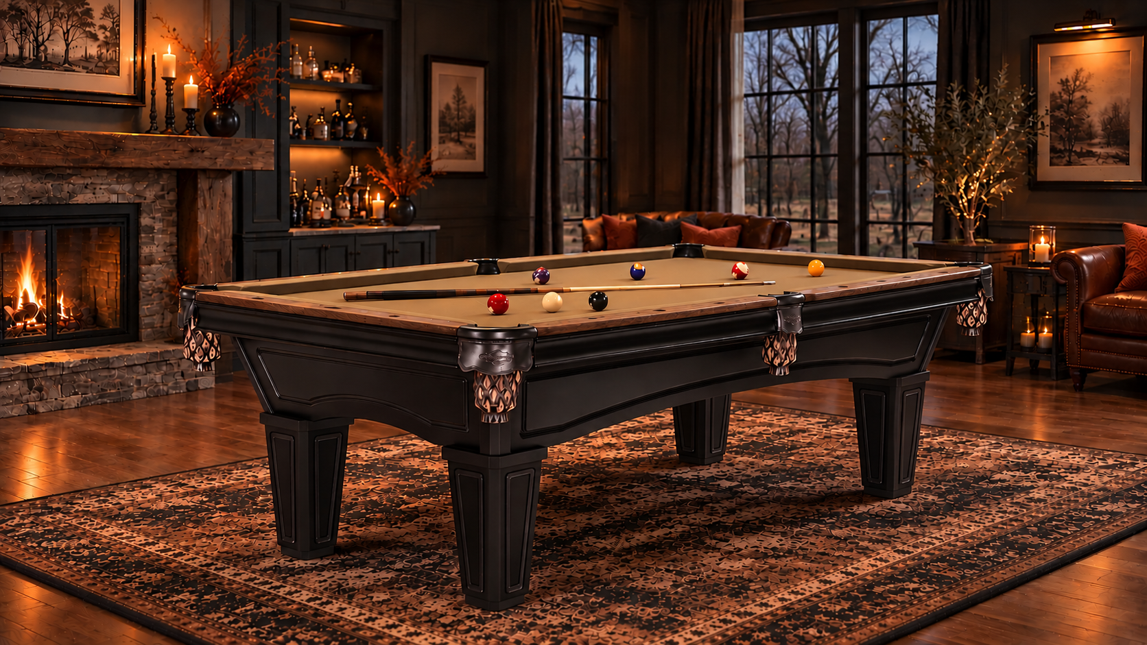 A black wooden pool table with a green felt surface and ornate claw legs, set in a luxurious, dimly lit living room with a fireplace, large windows, and warm ambient lighting.